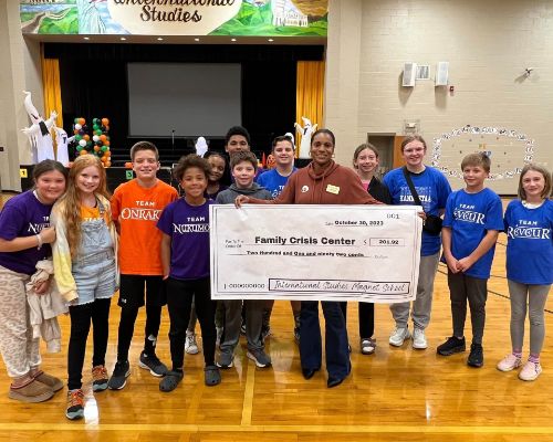  International Studies Donates Over $200 to the Family Crisis Center